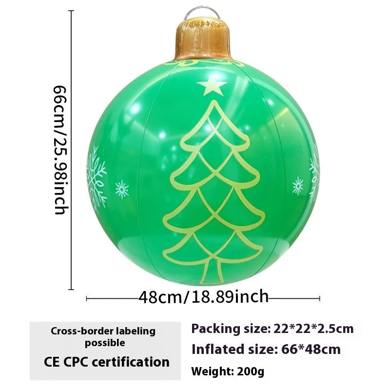 Large red inflatable Christmas ball with flash function displayed on a green garden lawn.
