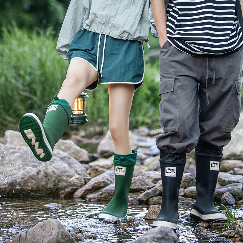 A pair of high tube PVC rain boots for men and women in a choice of colours.