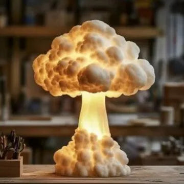 Modern art mushroom cloud atomic explosion shaped USB table lamp on a desk.