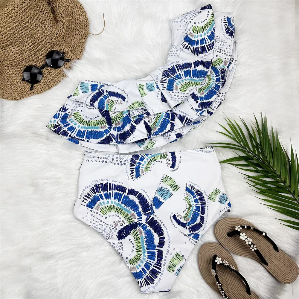 White women's one-shoulder swimsuit with lotus leaf design and side split detailing