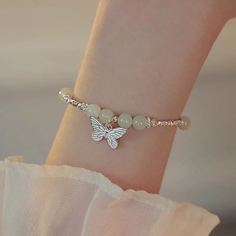 Women's butterfly jewellery set with bracelet and necklace featuring silver electroplated finish and Hetian jade details