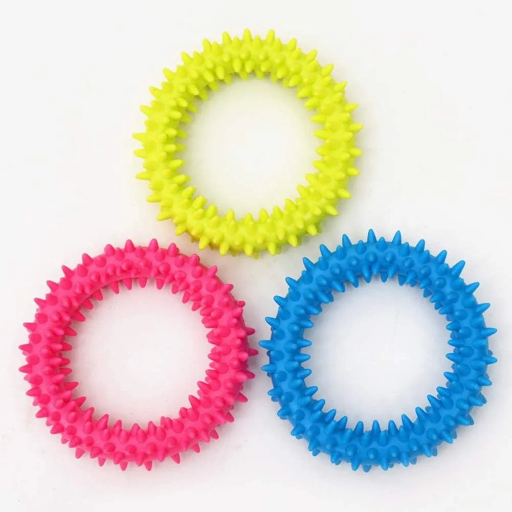 Blue TPR spiky circle ring dog chew toy on a white background.