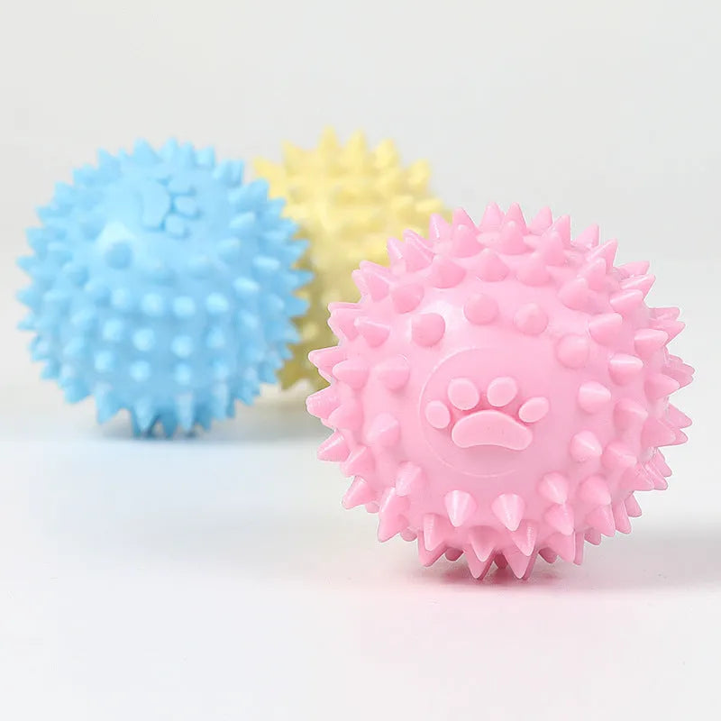 Blue TPR dog chew ball with textured footprint pattern and tooth cleaning nubs