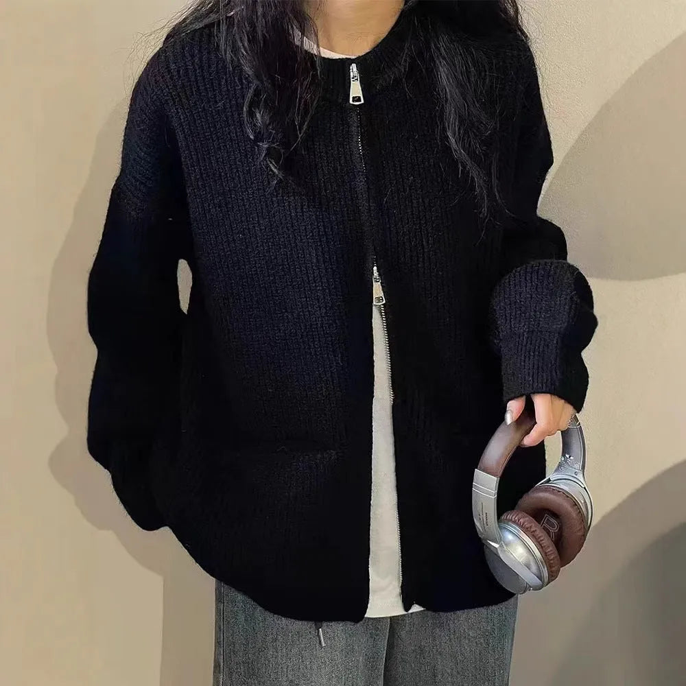Beige viscose sweater coat cardigan with long sleeves on a hanger.