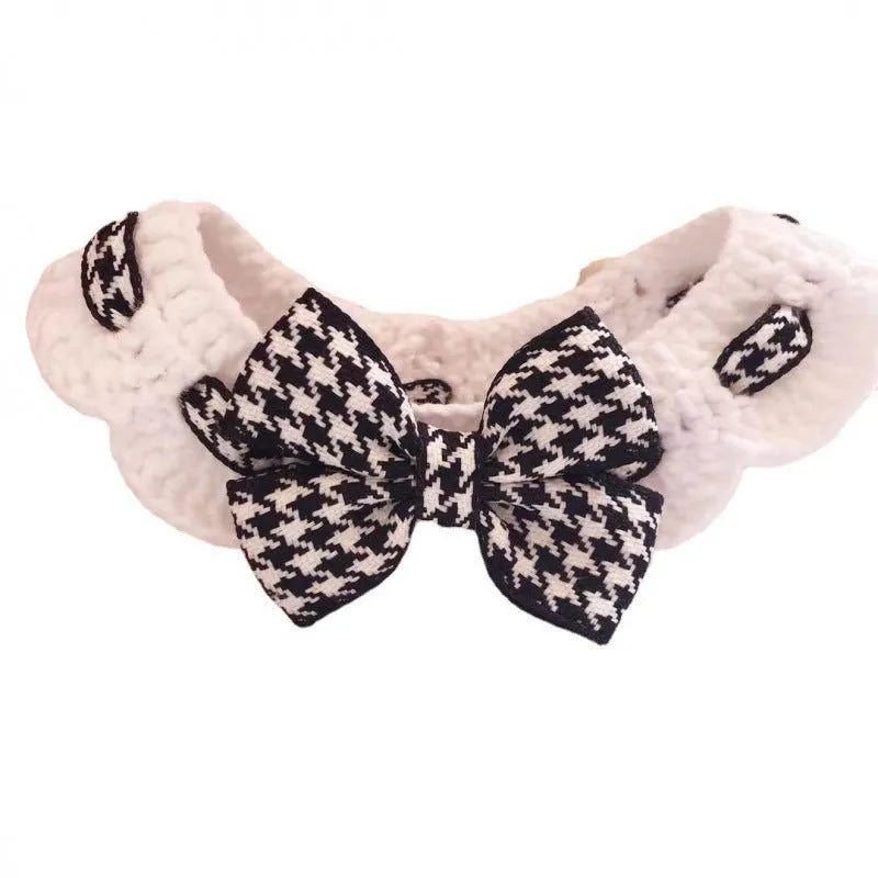 Black and red houndstooth patterned wool dog collar with a metal buckle closure on a white background.