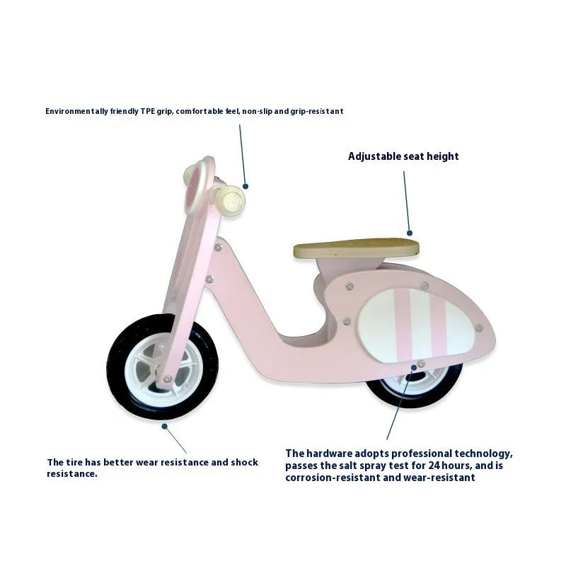 A pink wooden balance scooter for toddlers and children with a 10-inch deck.