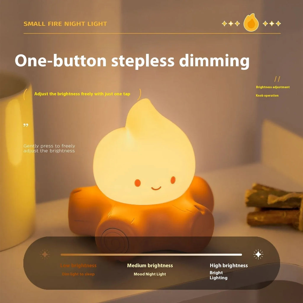 Small silicone fire pile cartoon night lamp with yellow light, showing compact design and ABS shade.