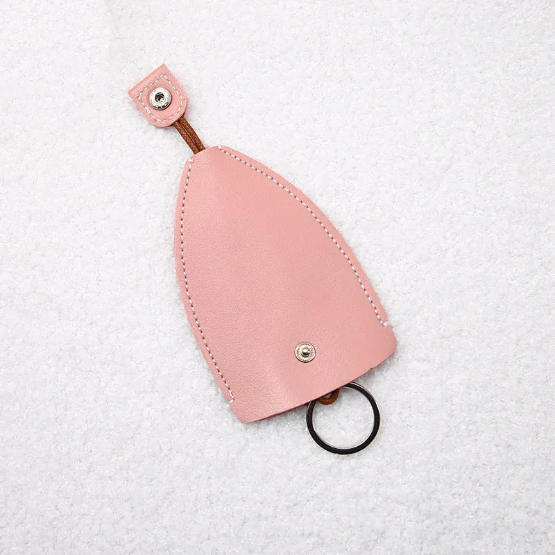 Cartoon pull-out key case in PU leather measuring 14 x 7.5 cm with colourful designs