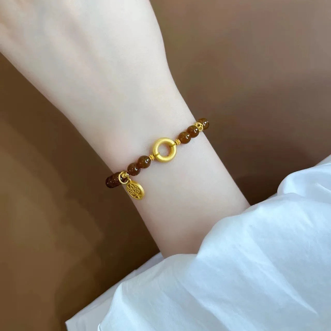 Women's caramel beeswax Lily bracelet with flower-shaped natural stone charm and electroplated finish.