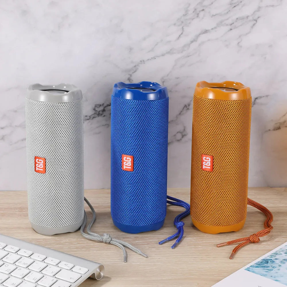 Fabric-covered portable Bluetooth speaker with card slot in camouflage colour.
