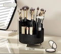 Rotating cosmetics storage box with makeup brushes and lipsticks organised on dressing table