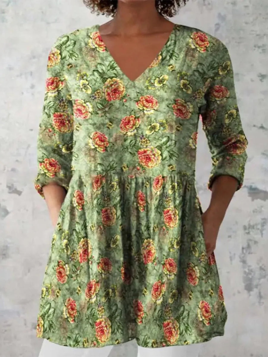 Women's loose-fitting long dress with a blue wave pattern print and 3/4 sleeves.