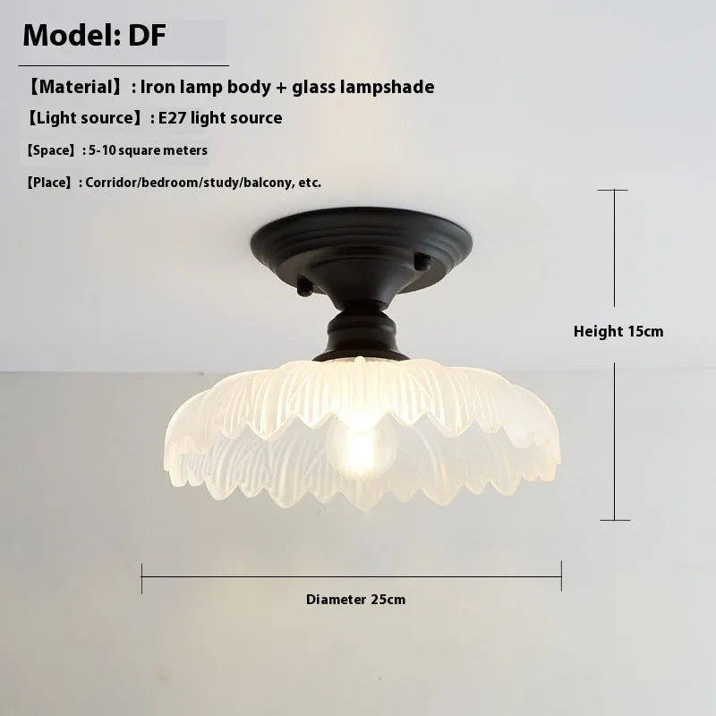 American retro single-head ceiling lamp with clear glass shade showing exposed filament style