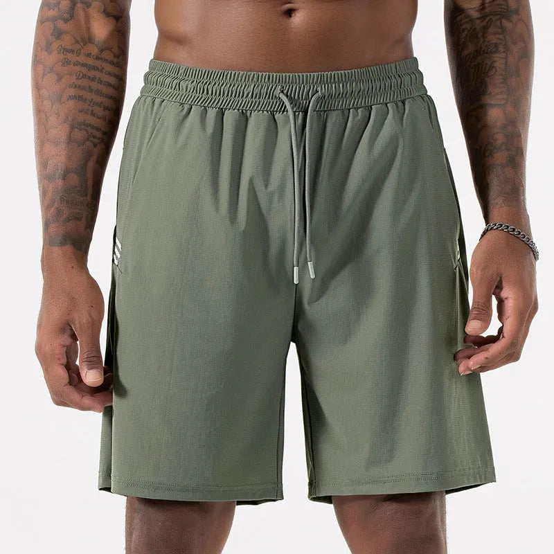 Man wearing black Ice Silk nylon sports shorts with a drawstring waist and cropped leg.