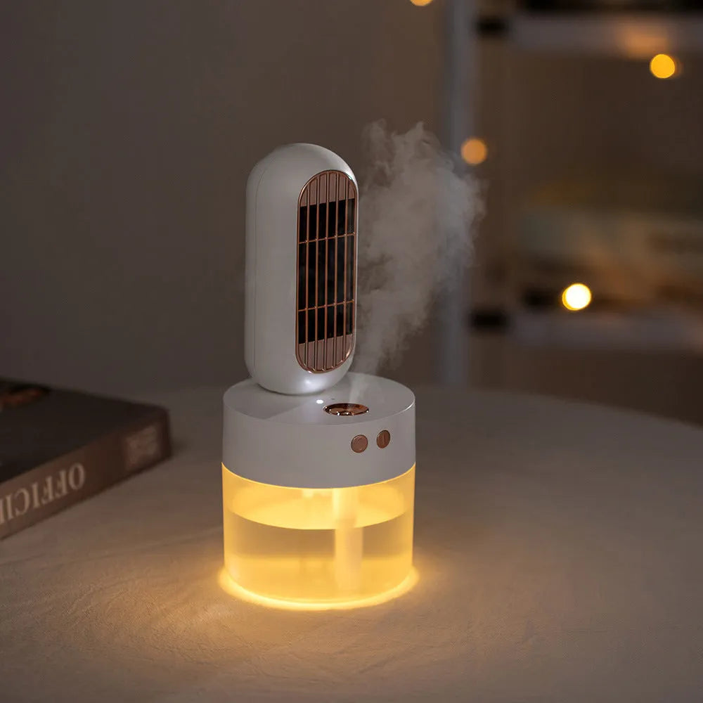 Small black and white portable humidifier fan with side-to-side head shaking feature and charging cable