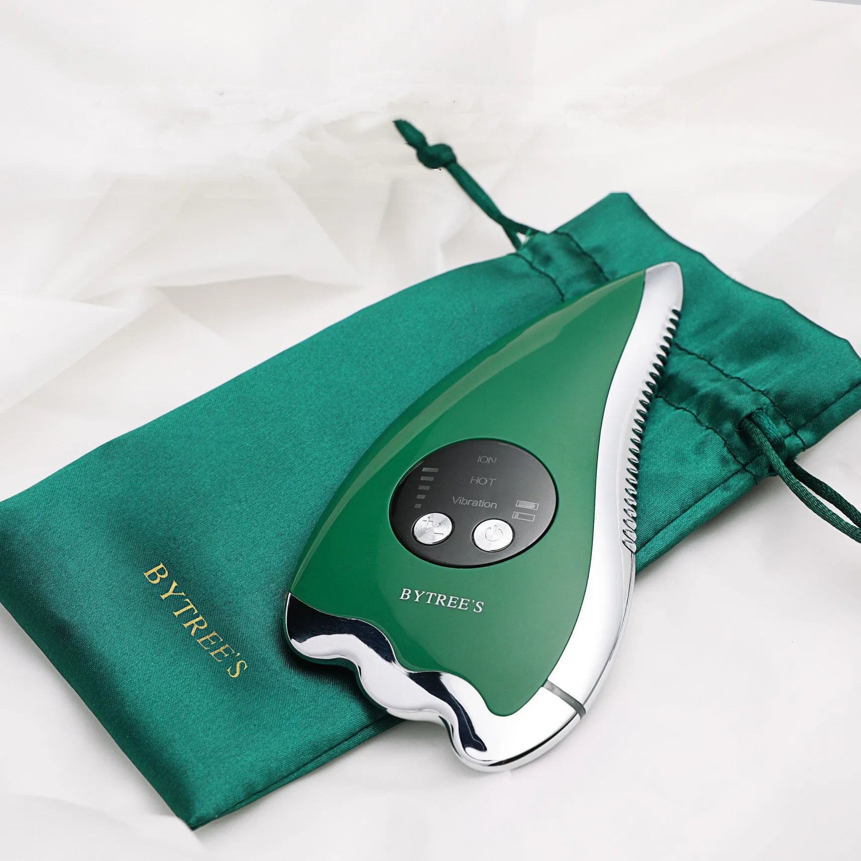 Green facial beauty instrument with plastic and metal body and USB cable