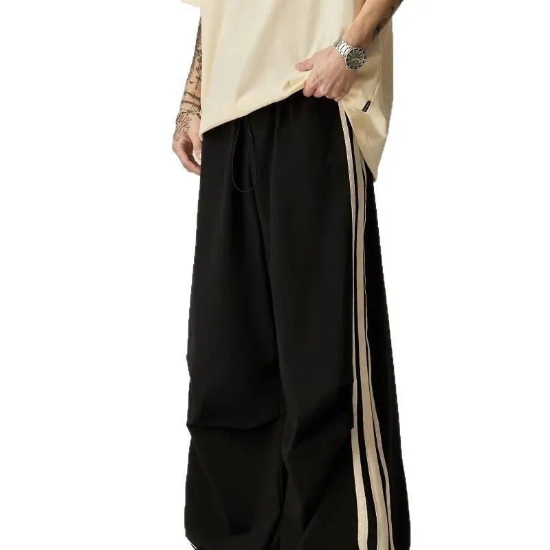 Black high-waisted wide leg straight trousers for men, made from polyester fibre.