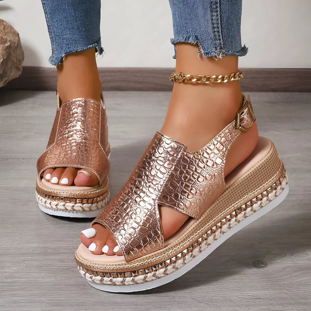 Gold women's Roman sandals with round toe, hollow-out design, and adjustable ankle buckle