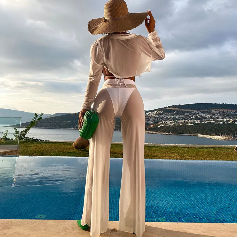 White four-piece women's swimsuit set with high-waist trousers and backless top
