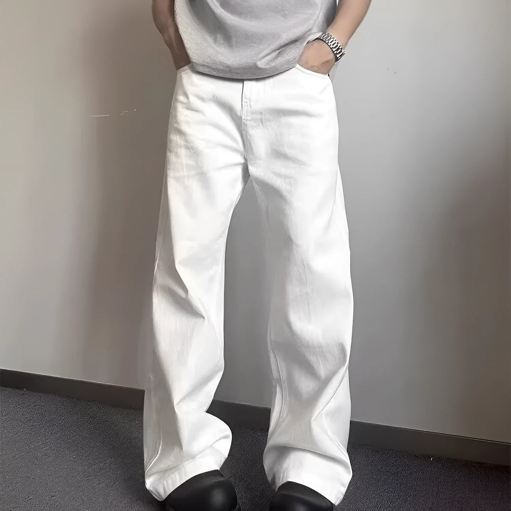 Men's straight leg white denim jeans with a mid waist and wide leg opening.