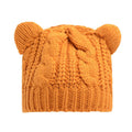 Handmade knitted winter beanie with 3D cat ears in red, shown on a model.