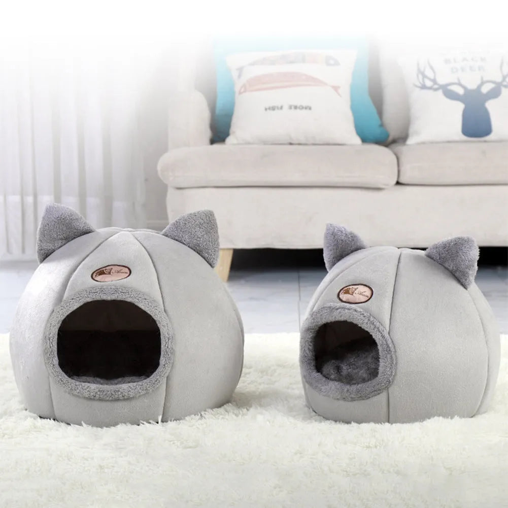Large grey enclosed sofa-style winter nest cat bed for indoor cats, showing removable fleece lining.