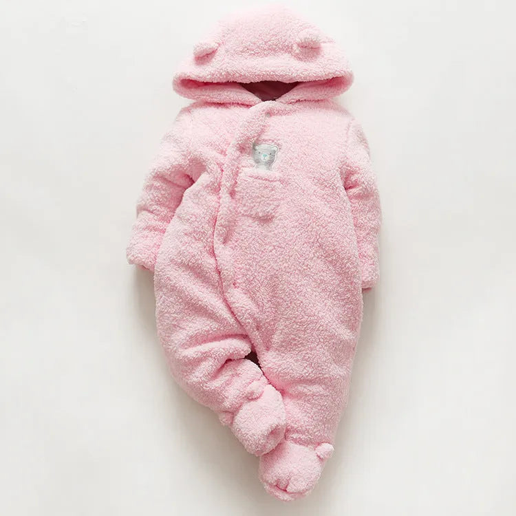 Baby wearing white cotton padded romper with lamb design and feet covers