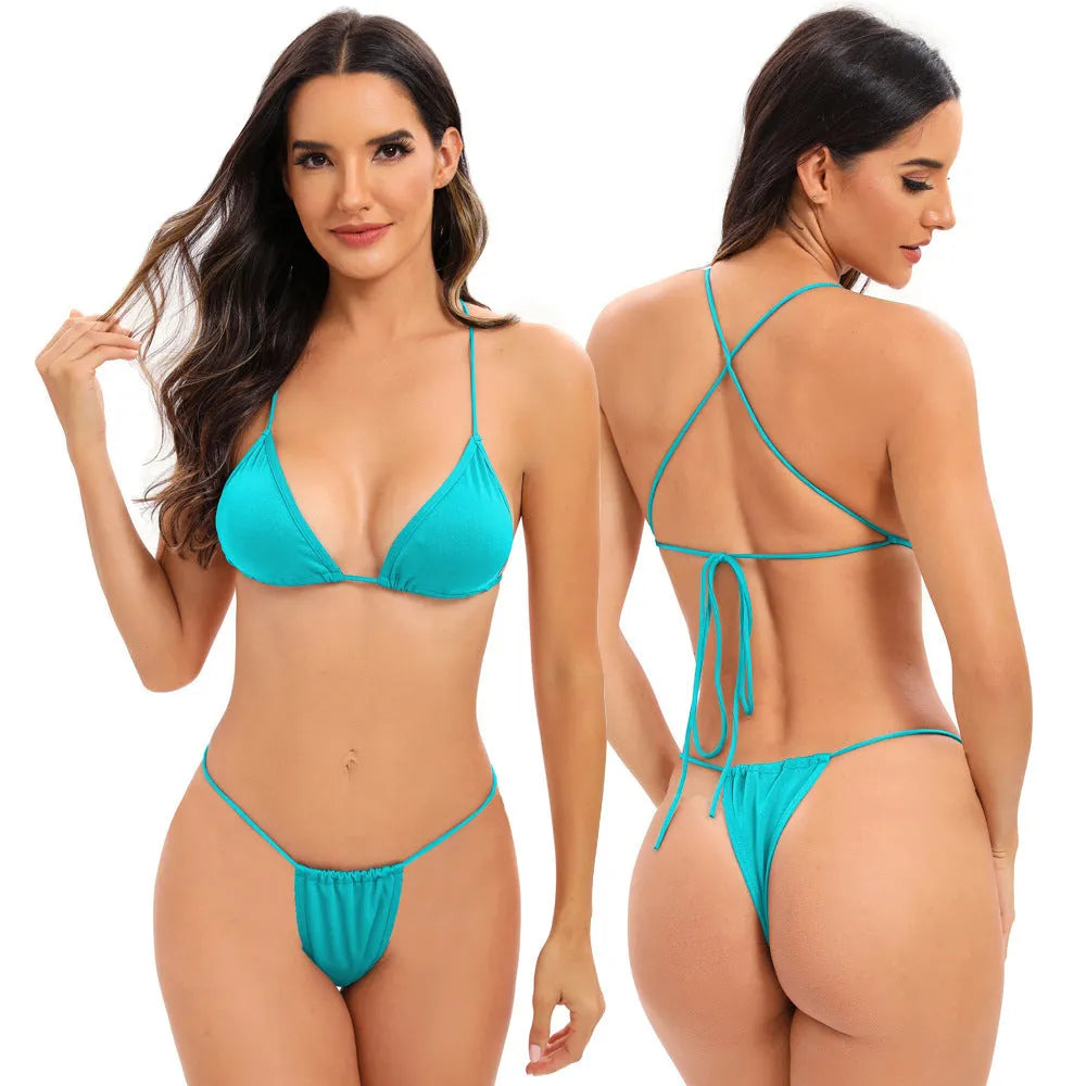 Women's candy coloured cross strap split swimsuit with adjustable multiple straps in striped spandex fabric.