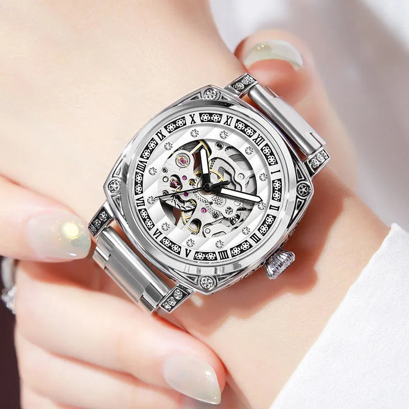 Men's mechanical watch with luminous hands and a black leather strap showing analogue dial.