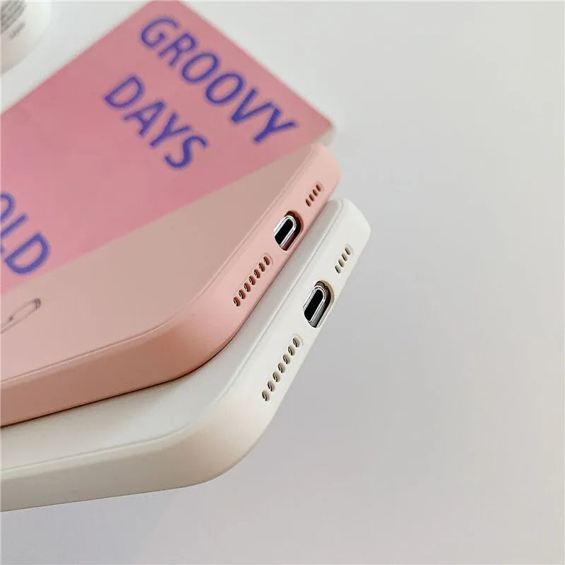 Solid colour TPU silicone back cover case for Apple iPhone on a table
