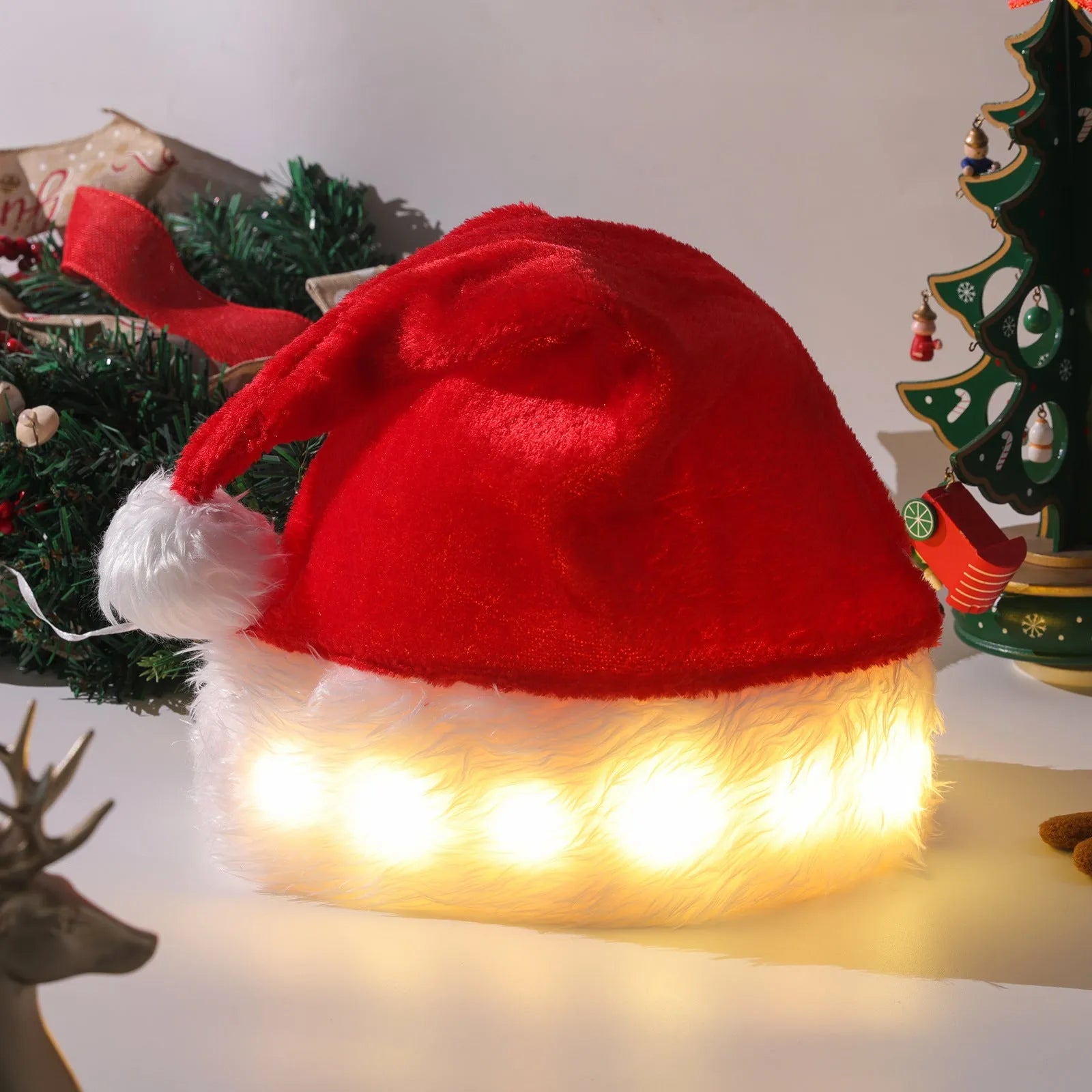 Red and white LED Christmas Santa hat with pom-pom and multi-colour lights
