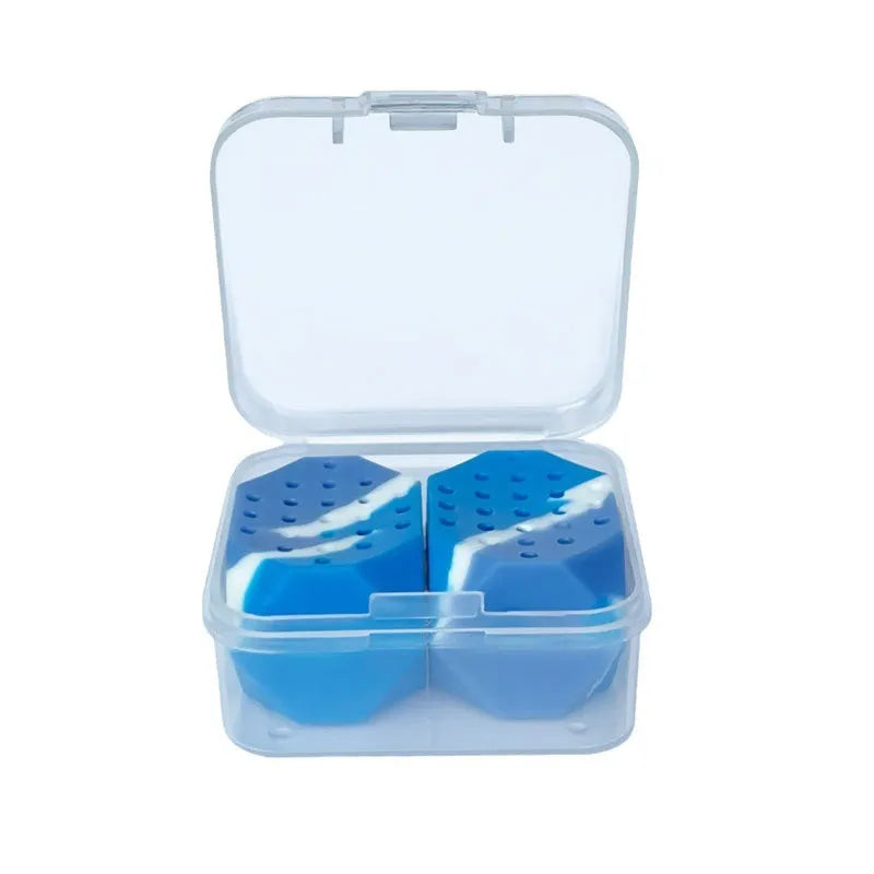 Two camouflage silicone facial muscle fitness balls for jaw training in a transparent box.