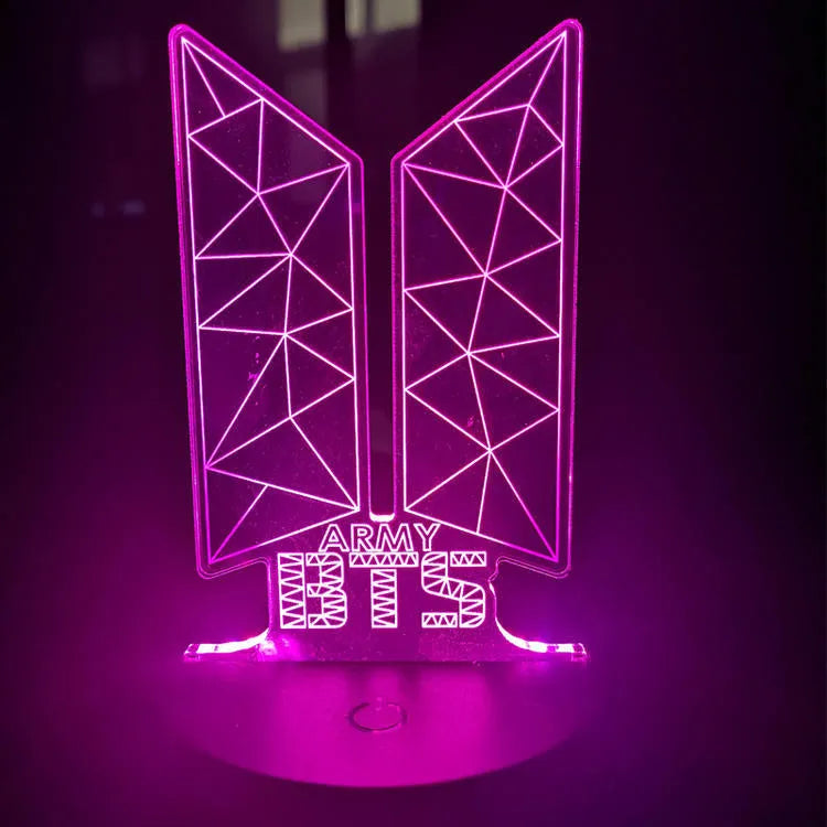 Transparent acrylic display stand showing illuminated BTS Light 101 Tower Gem collectible lamp.