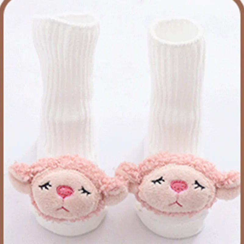 Cotton baby floor socks in a pink bow pattern, shown on an infant's feet.