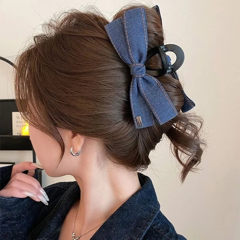 Handmade triangle grip hair clip with denim bow detailing in fabric and acrylic