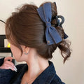 Handmade triangle grip hair clip with denim bow detailing in fabric and acrylic