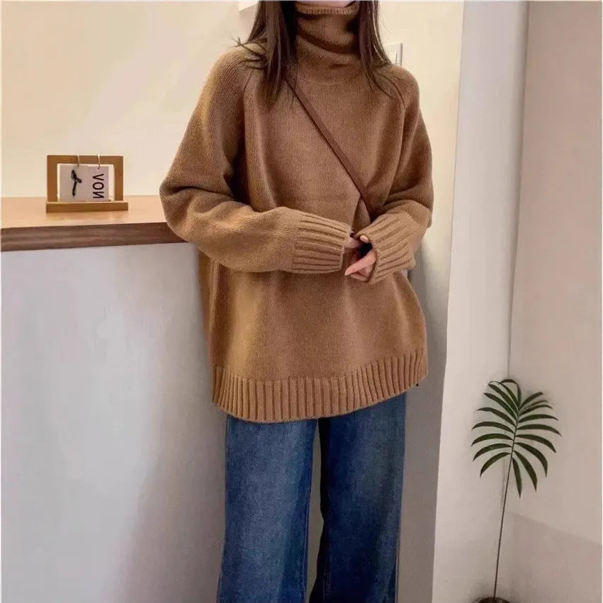 Red women's loose turtleneck sweater with a thick curling pile collar and a 3D pattern texture.