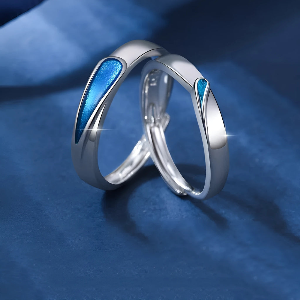Blue tear drop shape copper ring on finger with glossy glue dripping finish