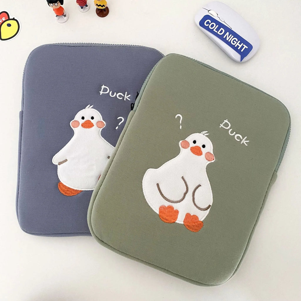 Blue cotton tablet case with embroidered cartoon duck design and a silver zipper.