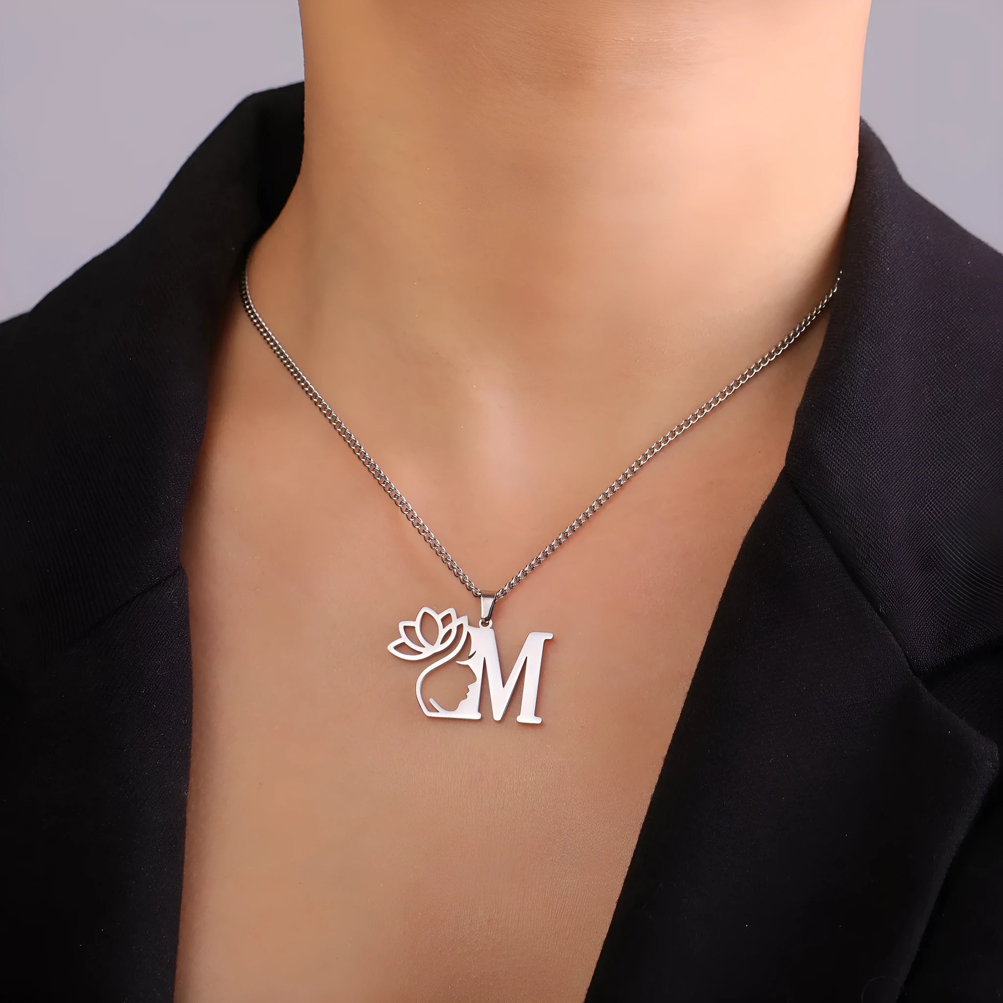 Stainless steel necklace with cross chain links and a single pendant in a gold finish.