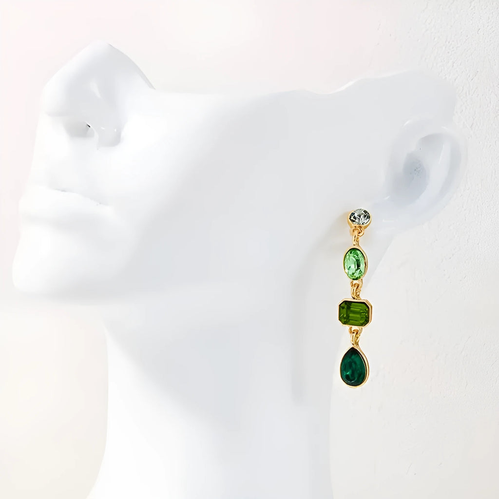 Female green round tassel long geometric earrings on display showing round acrylic and tassel drop