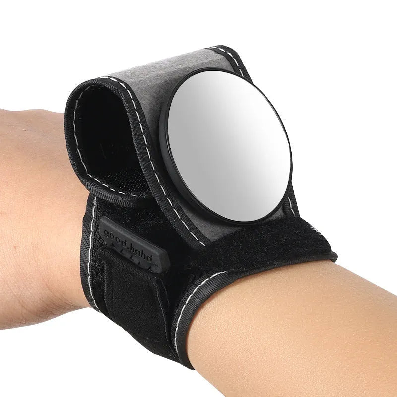 Black nylon cycling wrist rear-view mirror showing strap attachment and mirror positioning