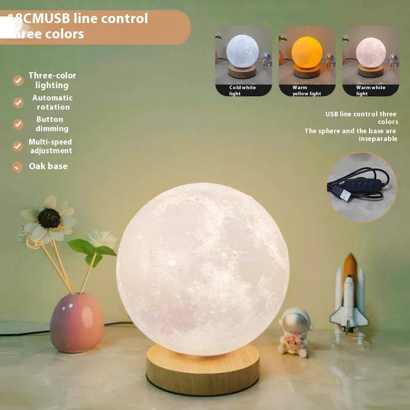 Rotating moon night light on wooden base showing three colour settings