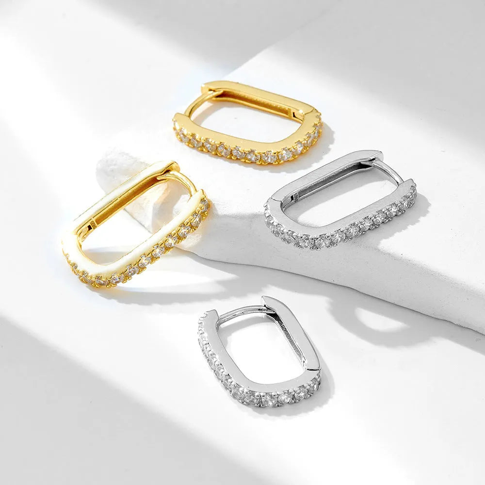 S925 sterling silver oval zircon earrings with geometric design and clip-on fitting