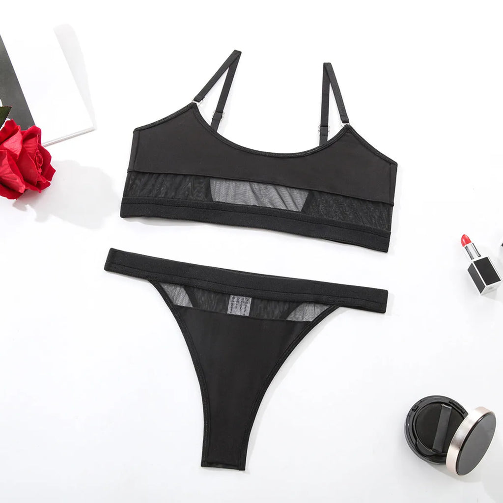 Black and white full cup bra and pants set for women on a hanger.
