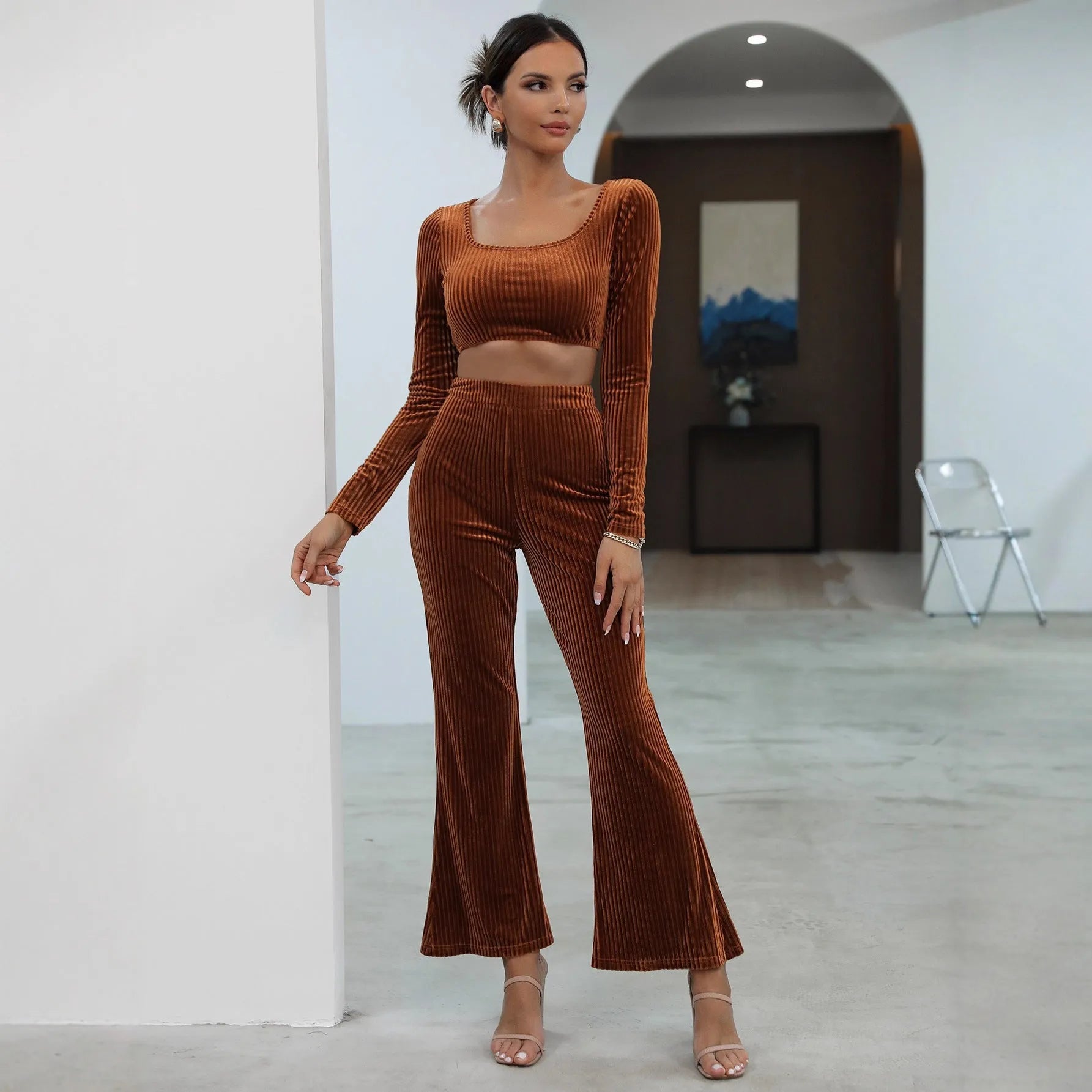 Caramel-coloured women's long sleeve sweater and trousers casual set on a hanger.