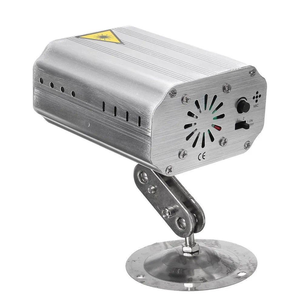 JC-24 dual laser light emitting red and green patterns against a dark indoor background with voice control remote included