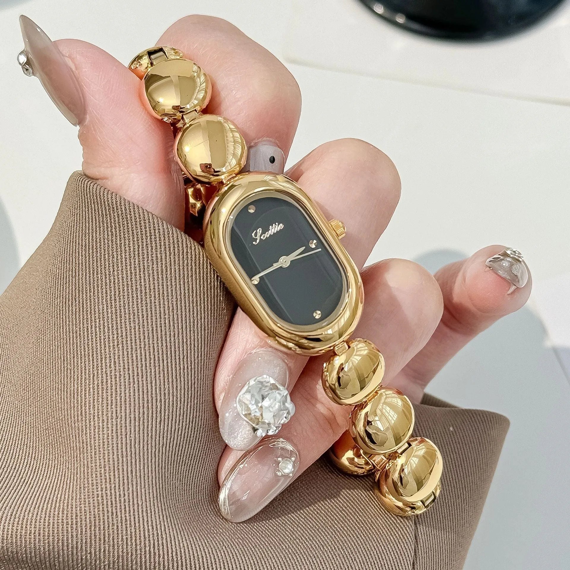 Women's oval gold-plated fashion watch in seven colour options with 9mm case thickness