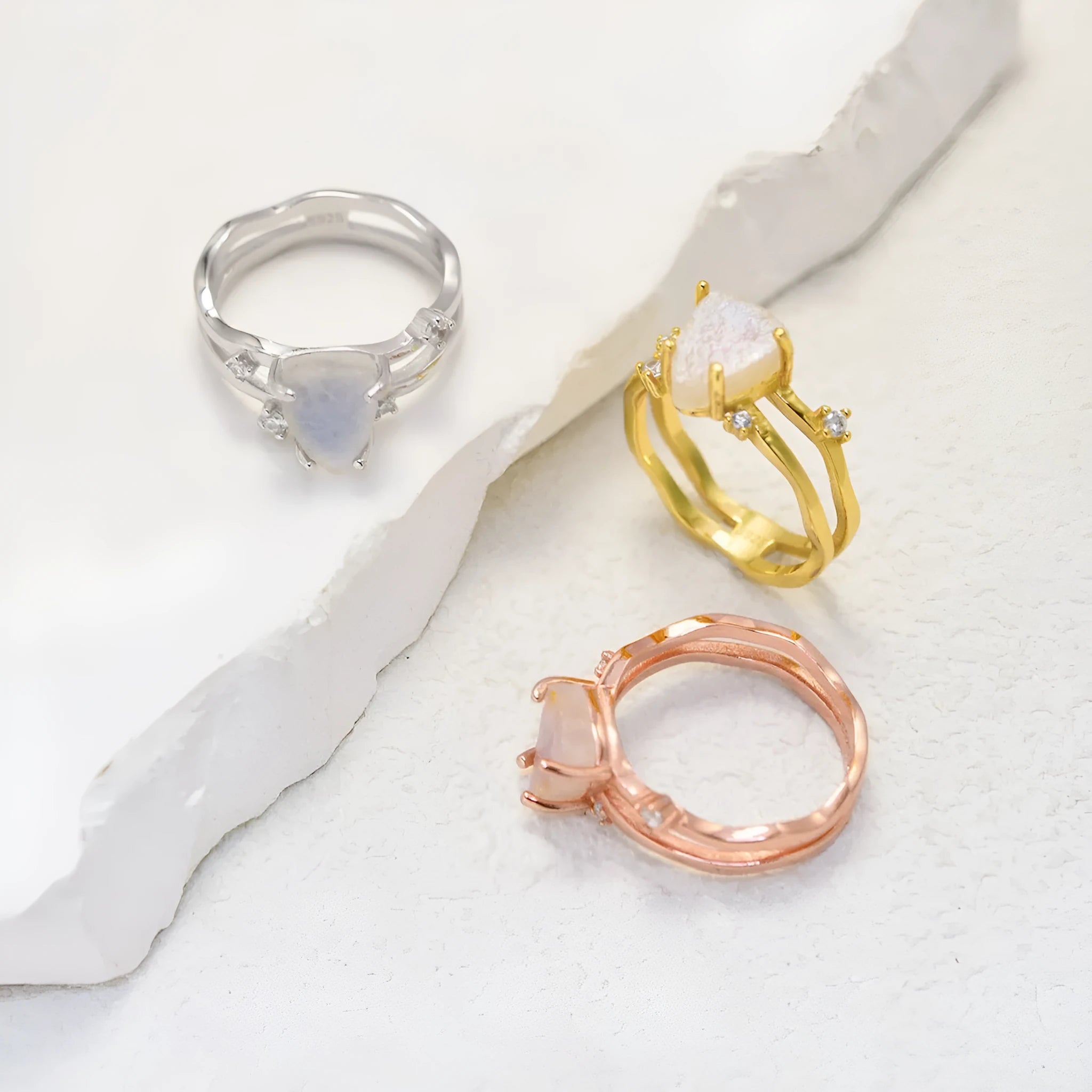 S925 silver geometric ring with an irregular triangle shape and moonstone setting in rose gold, white, or yellow gold colour.