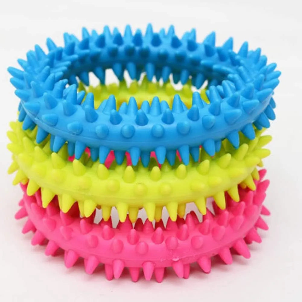 Blue TPR spiky circle ring dog chew toy on a white background.